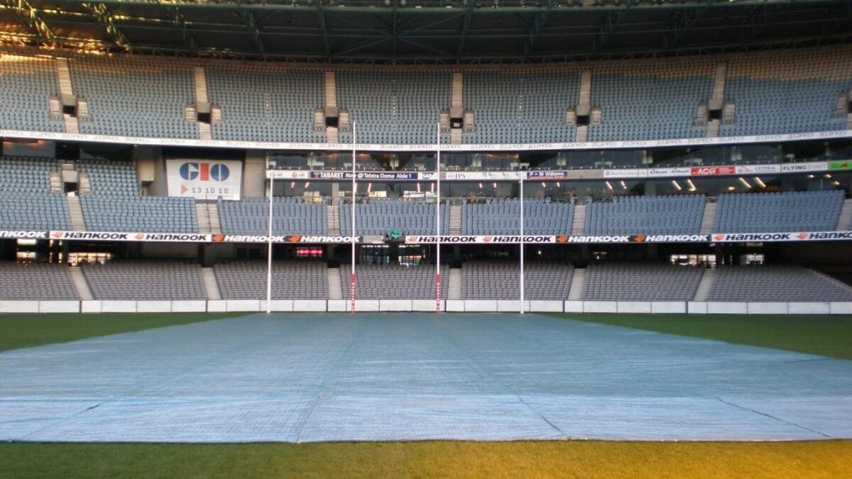 A stadium with a turf cover over the grass
